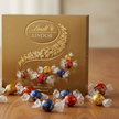 lindor box of chocolates with balls on a table