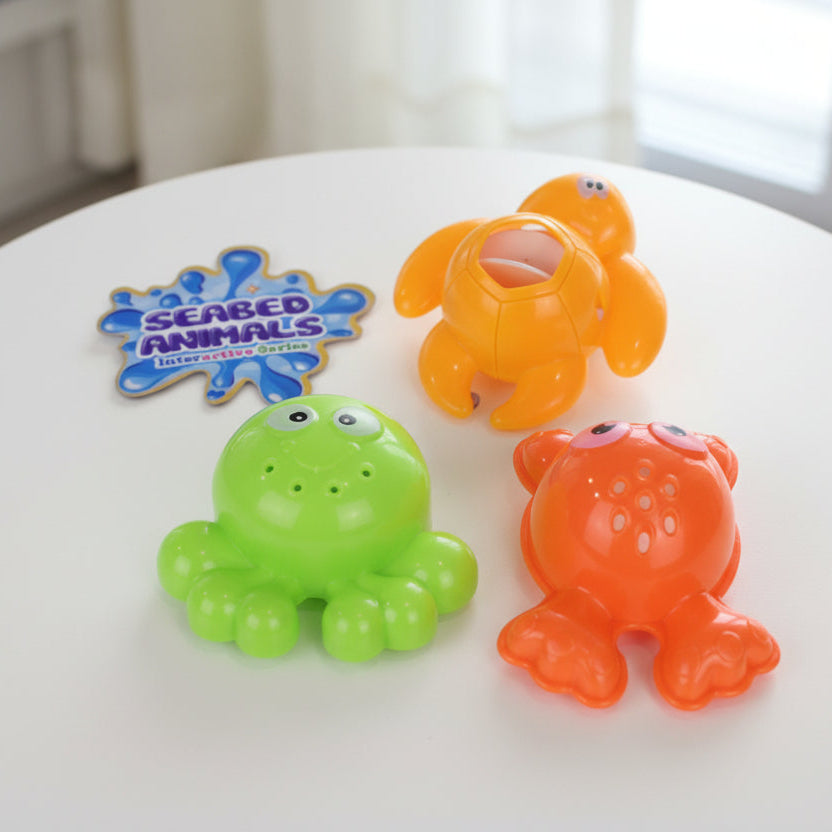Three colorful bath toys shaped like a turtle, octopus, and crab with 'Seabed Animals Interactive Series' logo.