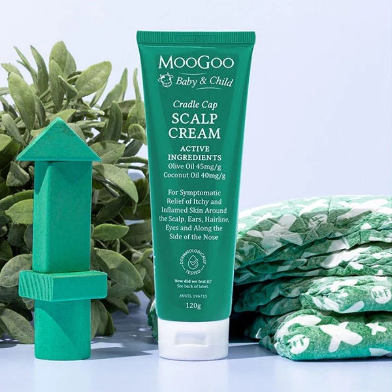 MooGoo Baby Scalp Repair Cream | green tub and toys