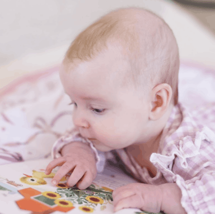 Baby reading  The Fuzzy Duckling Board Book
