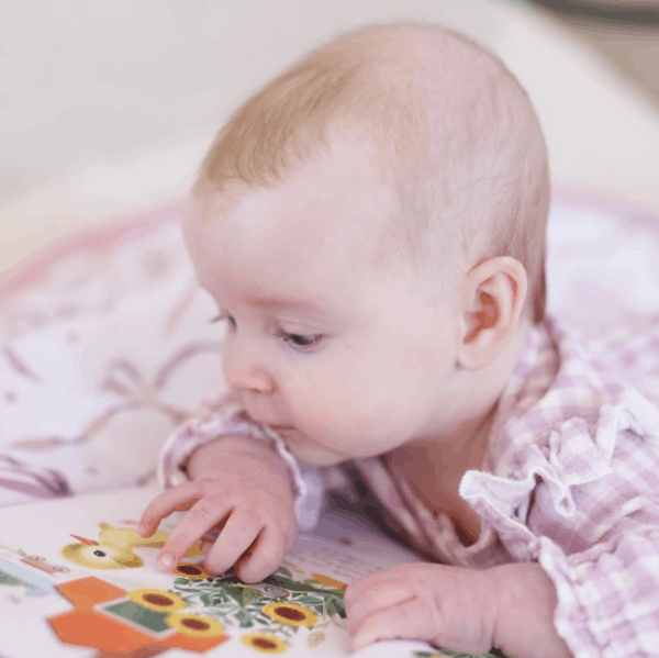 Baby reading  The Fuzzy Duckling Board Book