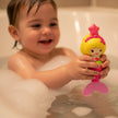 Munchkin mermaid bath toy with a child in the bath