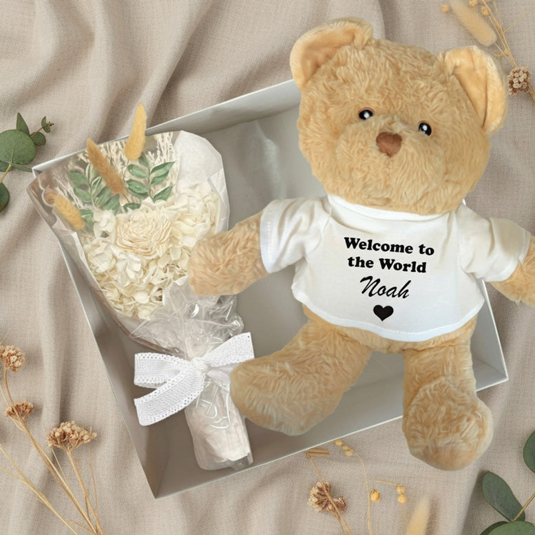 large brown personalised teddy bear with flowers in a gift box