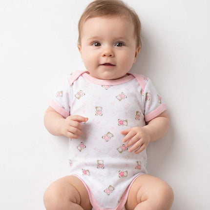 Baby wearing pink and white romper