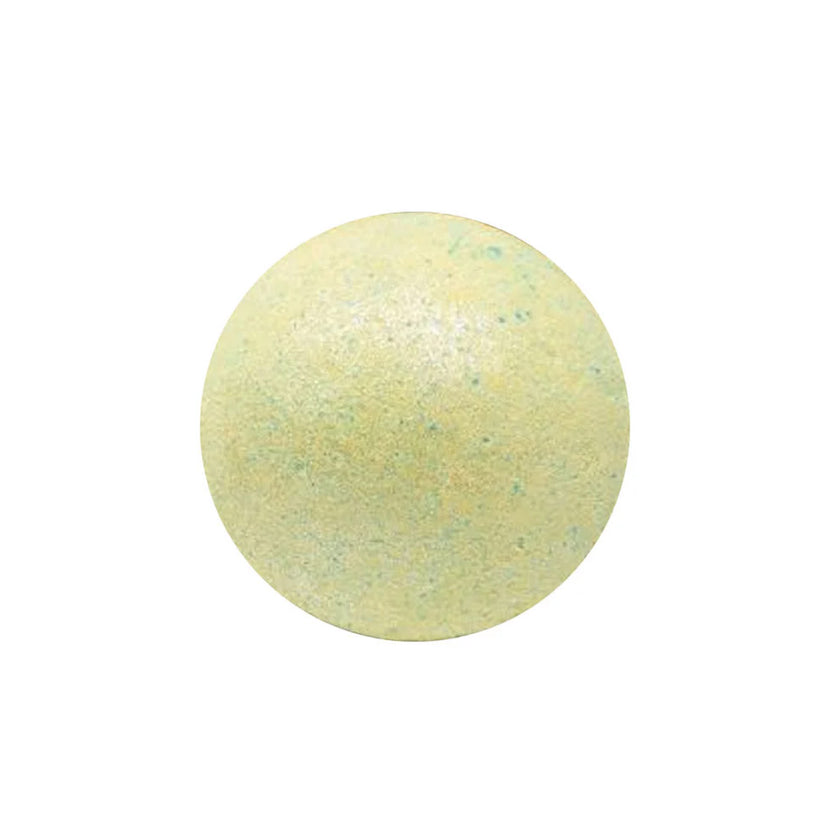 Green bath bomb on a white background