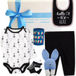 Baby gift set with onesie, bib, dad stubby, and baby pants from The Baby Gift Company.