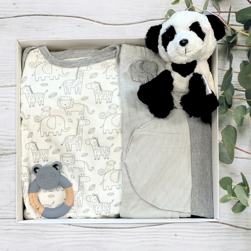 Baby gift set with panda plush toy, baby blanket, and rattle in a box.