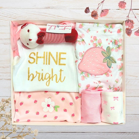 Baby gift set with 'SHINE bright' shirt, floral baby girl clothes , and strawberry pants for baby in a gift box.