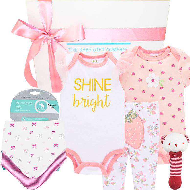 Baby gift set with onesie, bib, and rattle from The Baby Gift Company.