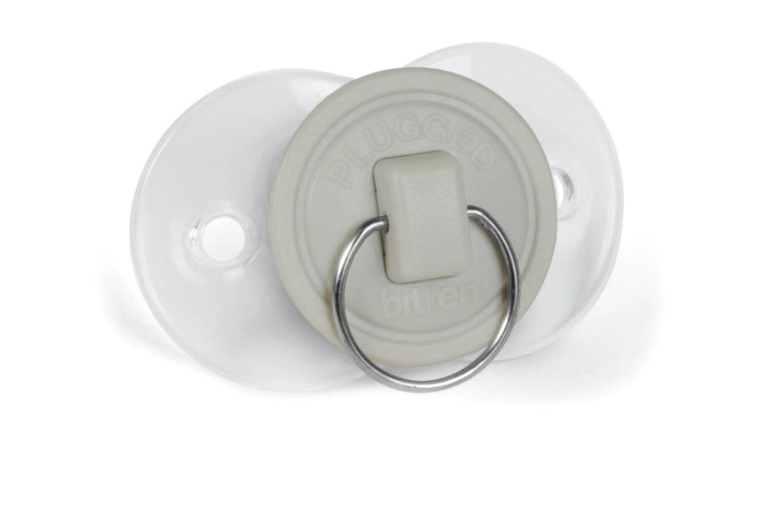 White pacifier with a metal ring on a white background
