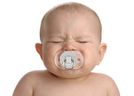 Baby with a pacifier on a white background