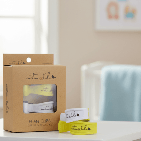 Yellow pram clips in nursery