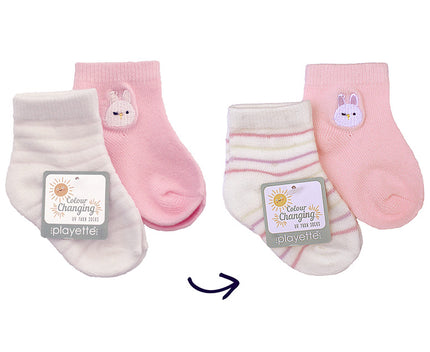 pink Two pairs of baby socks with bunny design on a white background