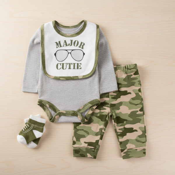 Baby outfit set with gray long-sleeve shirt, green camouflage pants, and matching socks on a beige background.