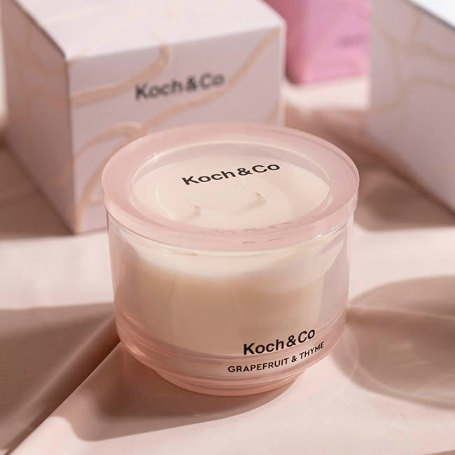 Koch & Co candle with packaging in the background