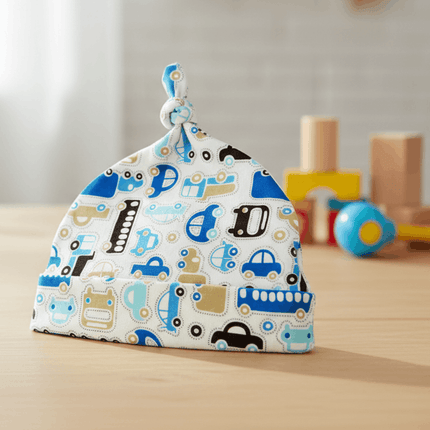 car design blue baby hat on wooden table