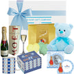 Gift basket with baby items including a teddy bear, bottle, and photo frame.