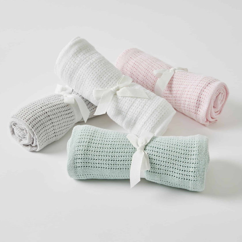 four Crochet Cellular Baby Blankets on white background