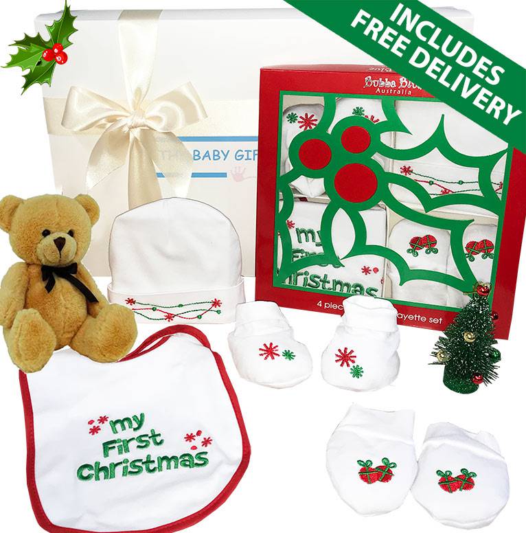 Christmas Joy Baby Gift Hamper with teddy bear, bib, booties, and decorative items on a white background.