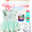 Baby gift set with dress, shoes, and Frozen-themed items from The Baby Gift Company.