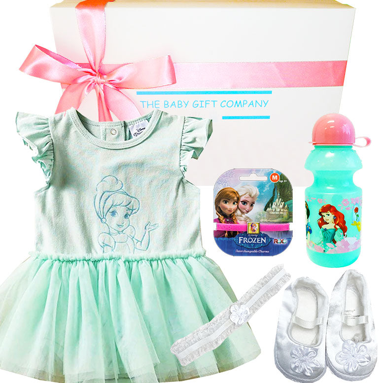 Baby gift set with dress, shoes, and Frozen-themed items from The Baby Gift Company.