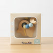Elephant Teether combines natural beech wood with soft, textured silicone beads in box on a wooden table background