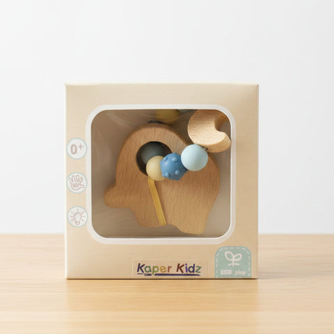 Elephant Teether combines natural beech wood with soft, textured silicone beads in box on a wooden table background