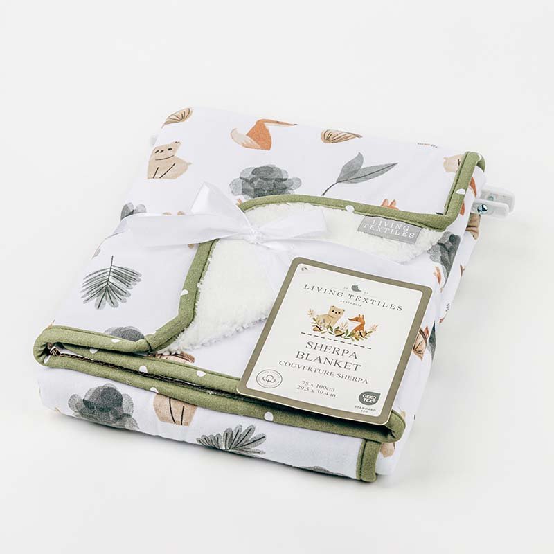 Forest Retreat baby blanket with prints and ribbon