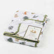 Forest Retreat baby blanket with prints and ribbon