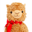 Plush toy llama with a red bow on a white background