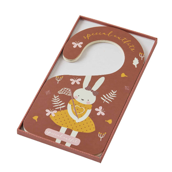 Hanger with rabbit design in a decorative box on a white background