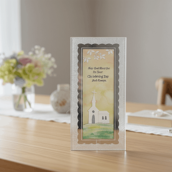 glass baptism plaque on wooden table