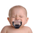 Baby with a pacifier on a white background