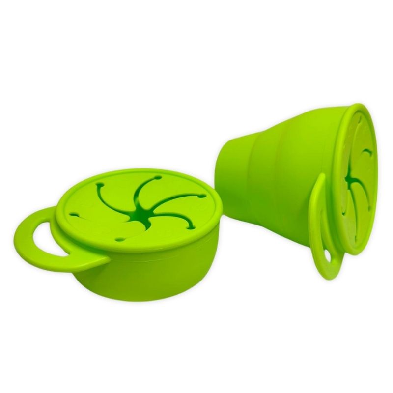Green silicone cup with lid on a white background