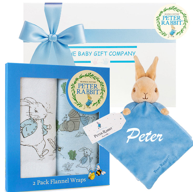 Peter Rabbit baby gift set with flannel wraps and plush toy on a white background