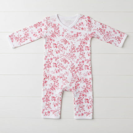Baby onesie with red floral pattern on a white background