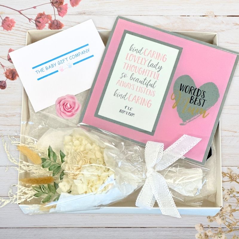 Gift box with flowers, card, and decorative elements from the baby gift company