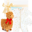 Plush llama toy with a red bow and baby outfit in a bag, branded 'The Baby Gift Company'.