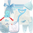 Baby gift set with clothing, bib, and plush toy from The Baby Gift Company.