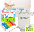 Baby gift set with onesie, books, and xylophone from The Baby Gift Company.