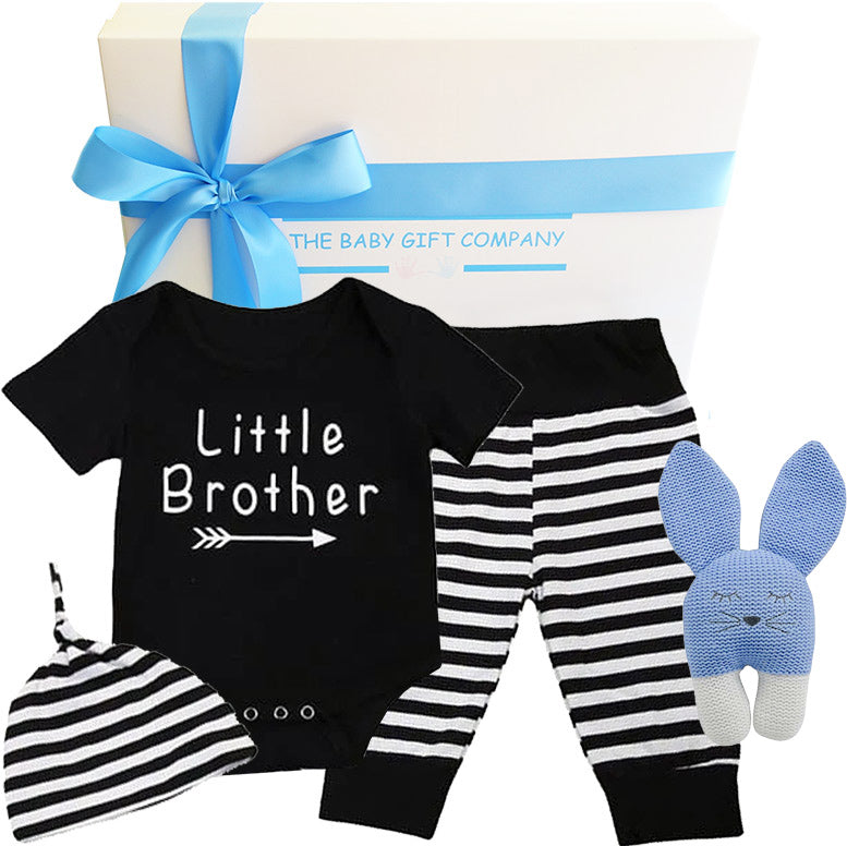 Baby gift set with 'Little Brother' onesie, striped pants, hat, and rabbit plush toy, branded 'The Baby Gift Company'.