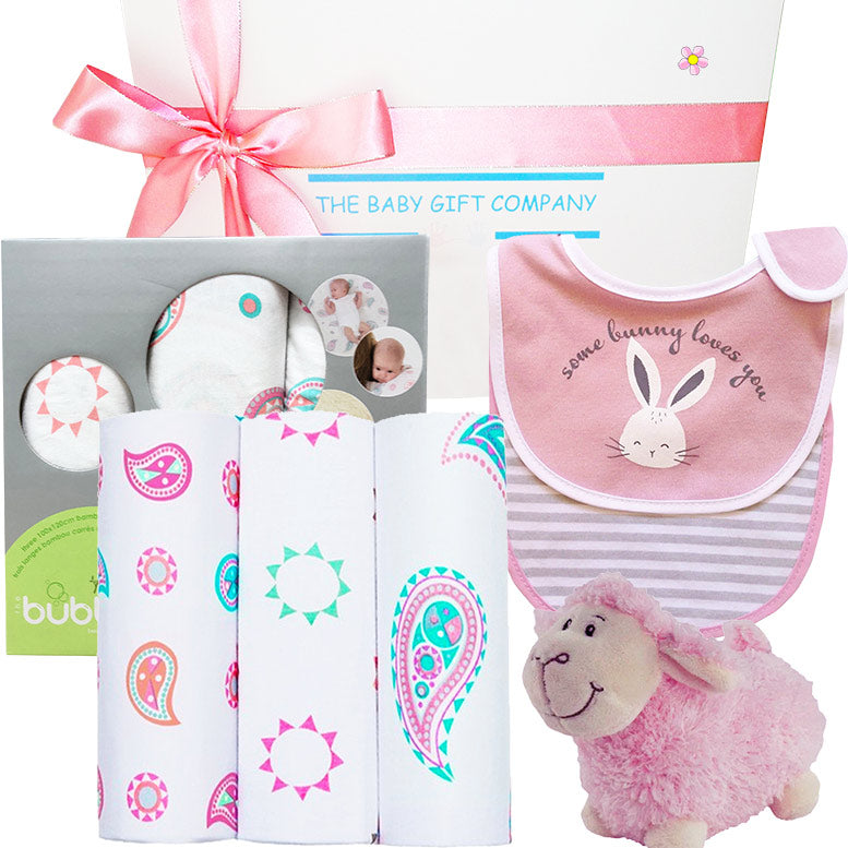 Baby gift set with bib, burp cloths, and plush toy from The Baby Gift Company.