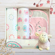 Gift box with aby wraps and pink bibs and pink lamb toy