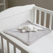 Gray blanket with a white bunny plush toy on a white background