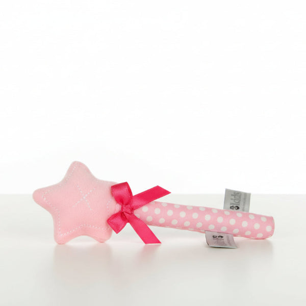 Pink star-shaped rattle with a red ribbon and white polka dots on a white background, featuring 'es kids' branding.