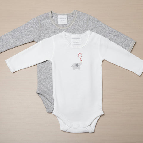 Gray and white baby bodysuit on a table