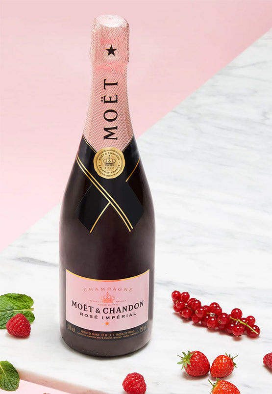 Moét & Chandon champagne bottle with pink label on a light background