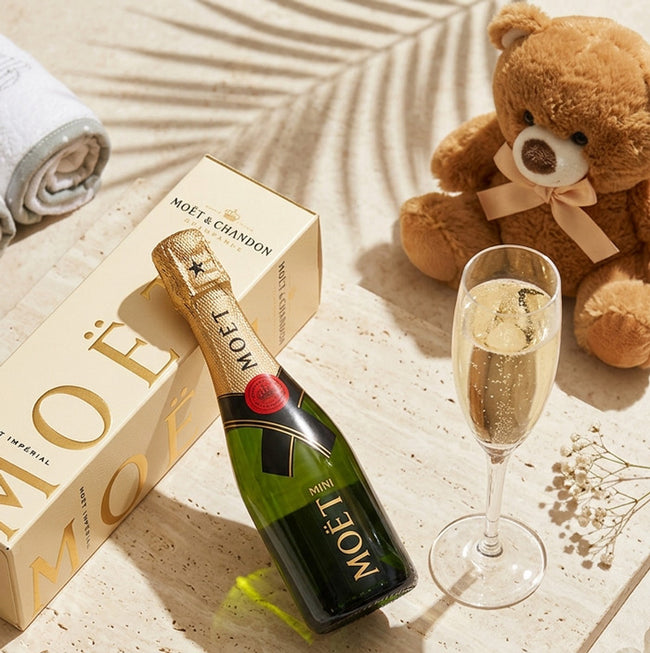 Mini Moët champagne bottle and box with brown teddy bear and glass of champagne