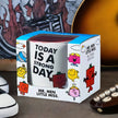 Box of Mr. Men Little Miss mug with colorful characters on a blurred background