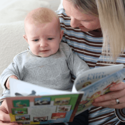 Mum reading The Fuzzy Duckling Board Book to baby